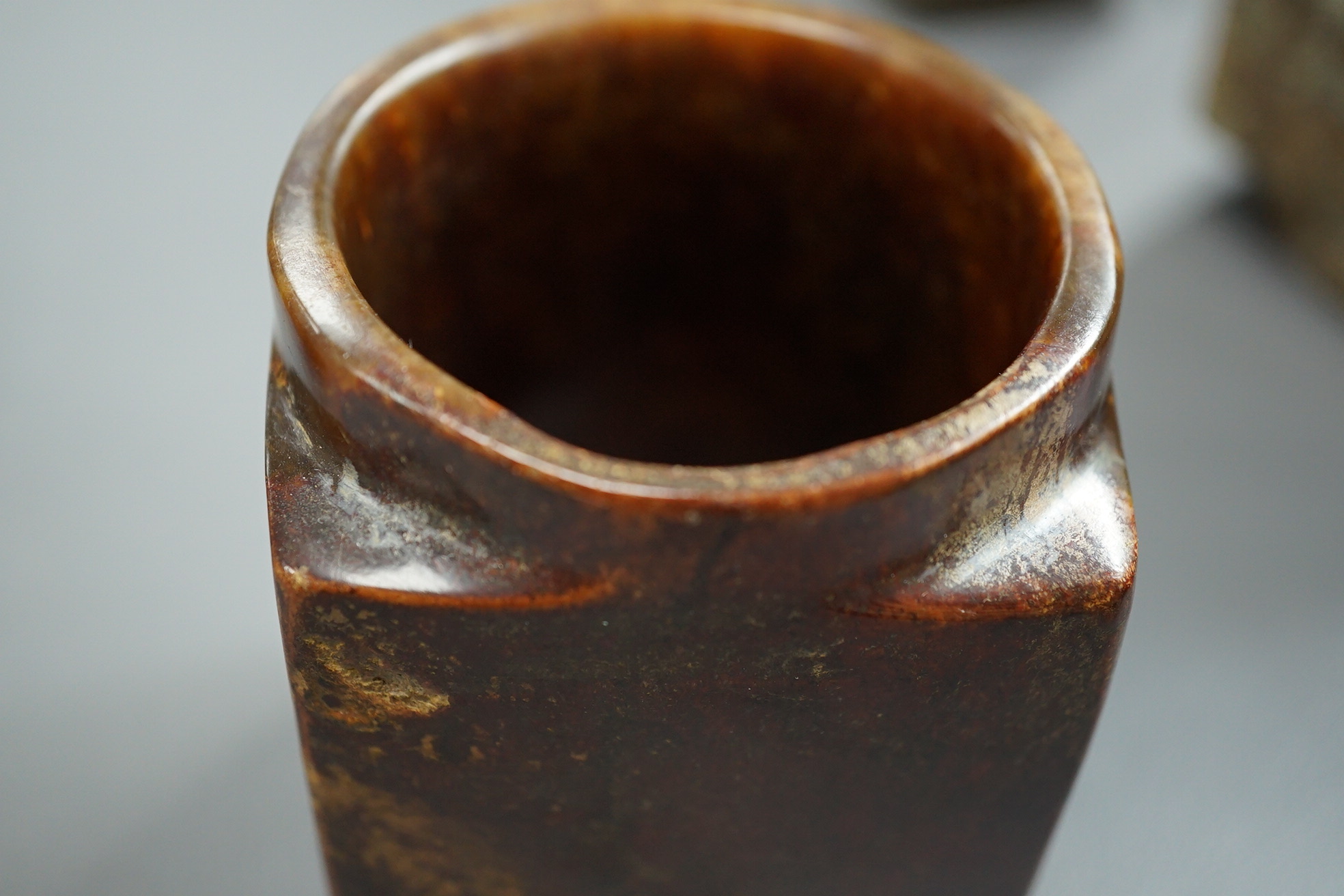 Four Chinese archaistic jade or hardstone cong